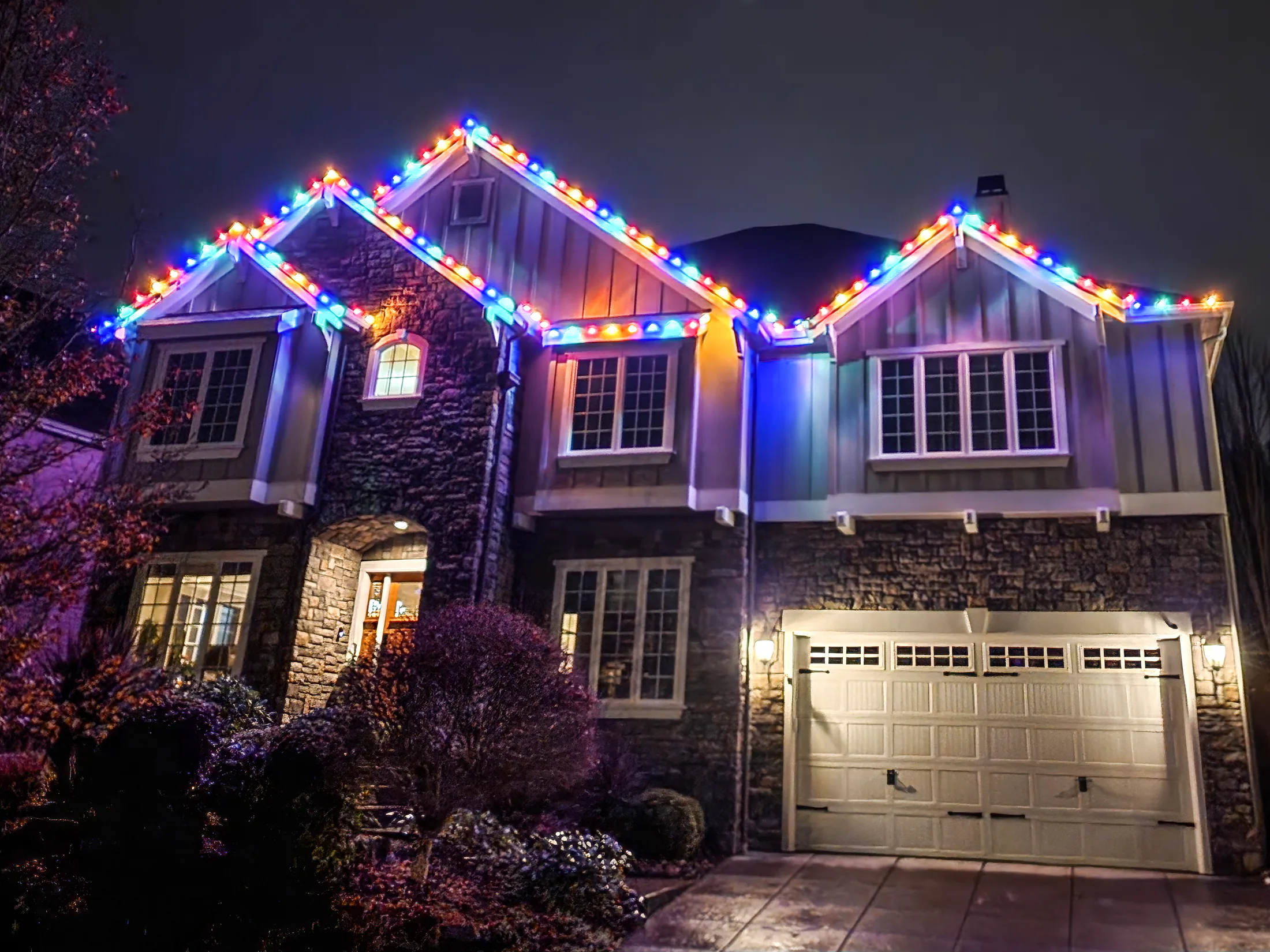 Residential Christmas light installation 6 by Premium Holiday Lights in Salem, OR, warm commercial-grade C9 LED roofline lighting at night