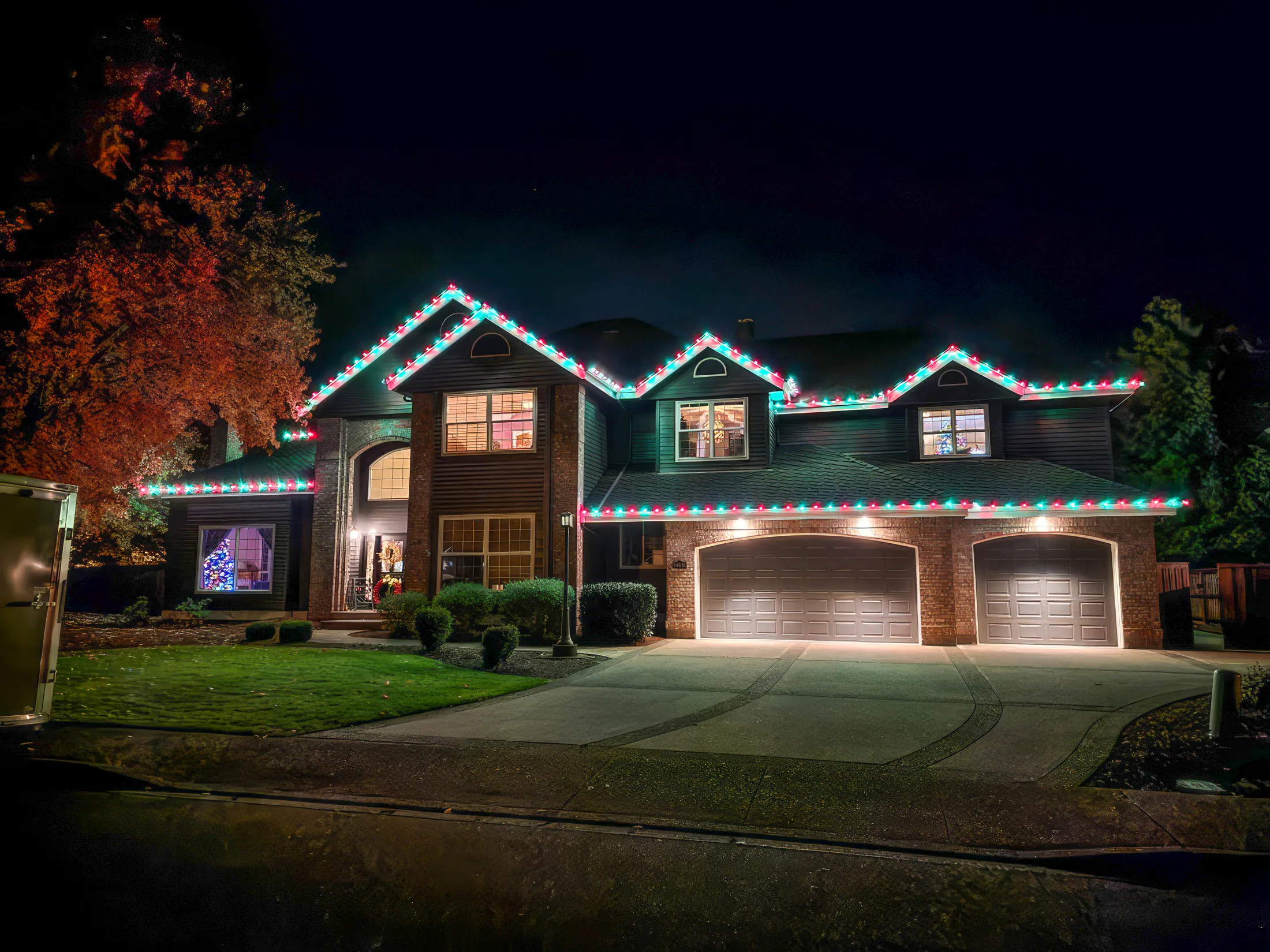 Residential Christmas light installation 1 by Premium Holiday Lights in Salem, OR, warm commercial-grade C9 LED roofline lighting at night