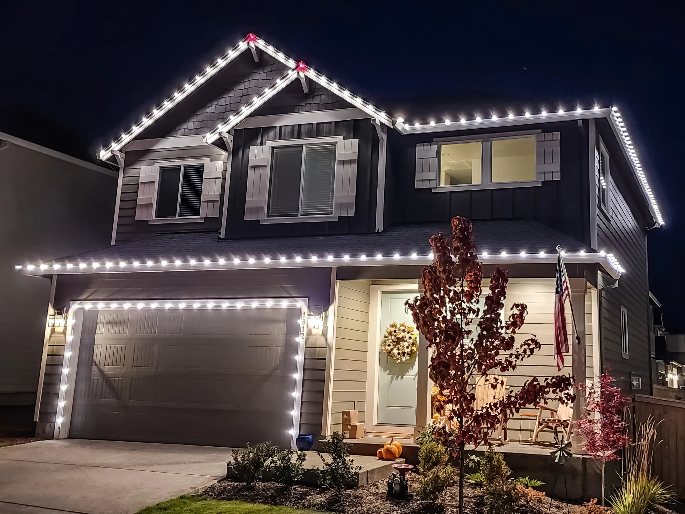 Residential Christmas light installation 9 by Premium Holiday Lights in Salem, OR, warm commercial-grade C9 LED roofline lighting at night