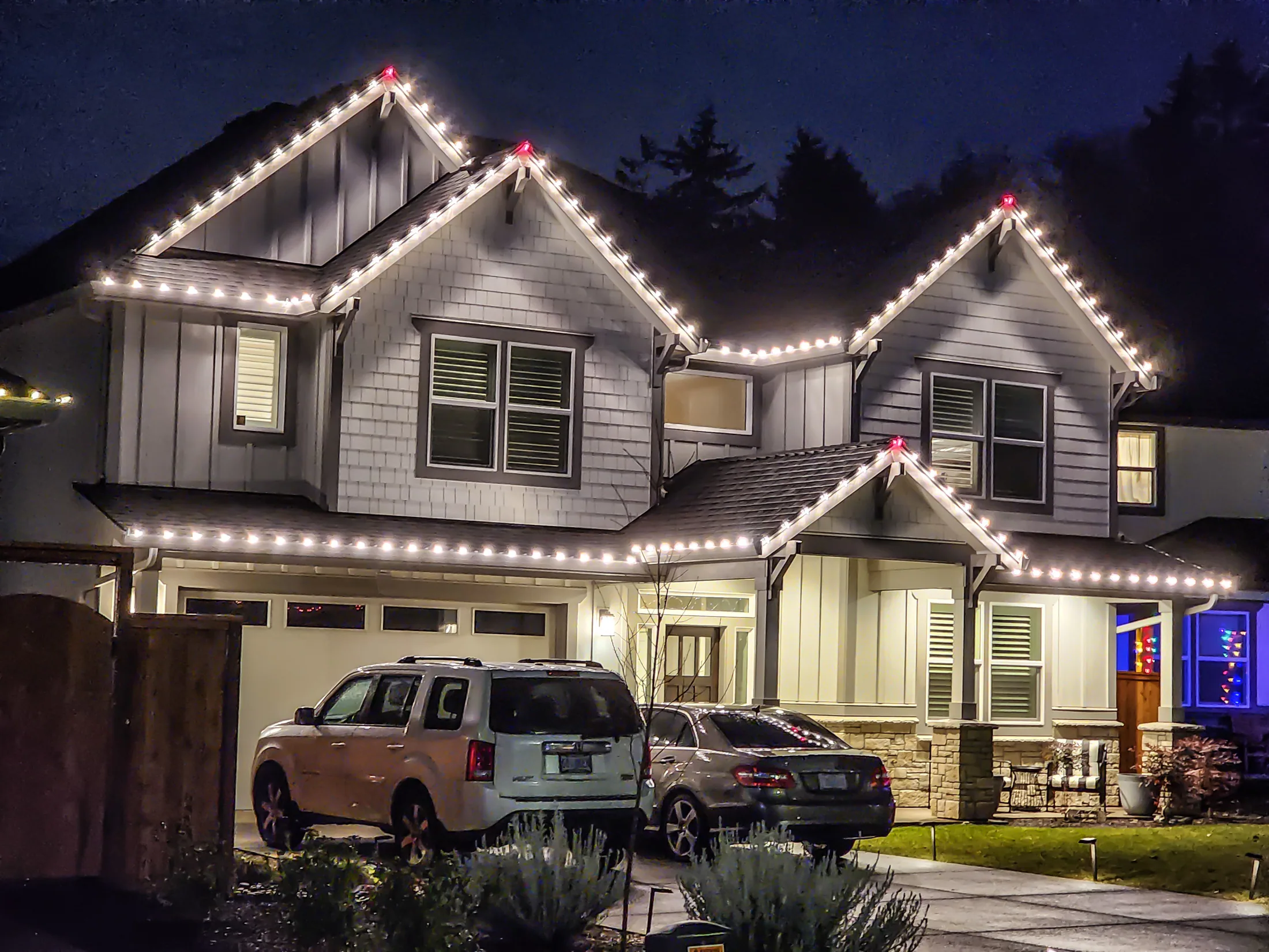 Residential Christmas light installation 8 by Premium Holiday Lights in Salem, OR, warm commercial-grade C9 LED roofline lighting at night