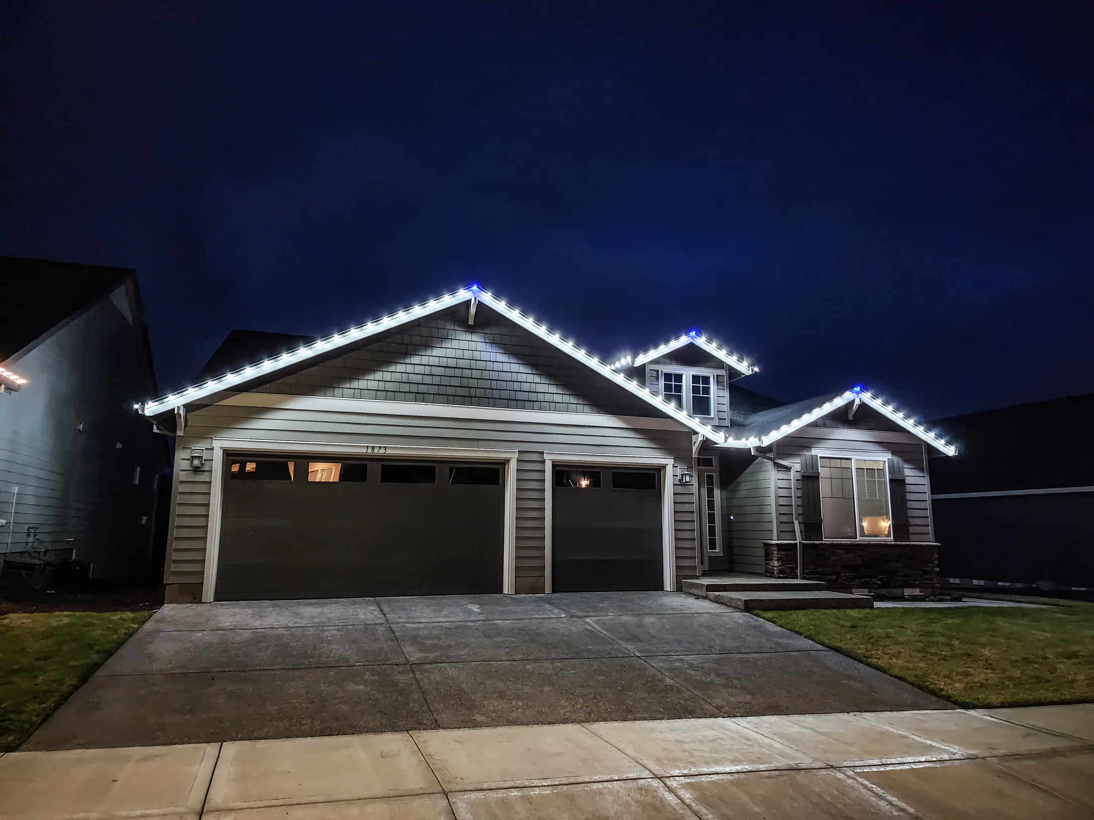 Residential Christmas light installation 14 by Premium Holiday Lights in Salem, OR, warm commercial-grade C9 LED roofline lighting at night