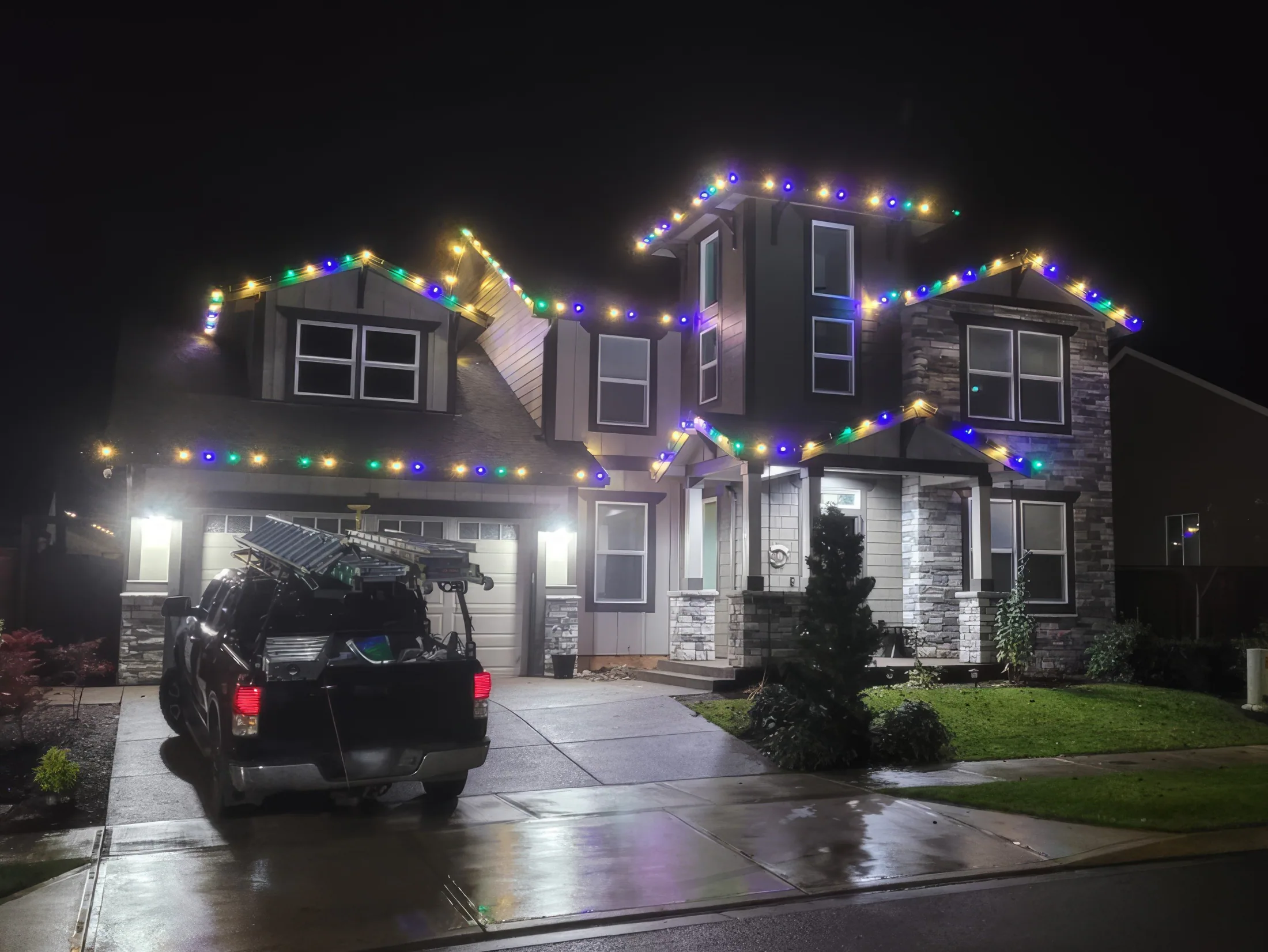 Residential Christmas light installation 18 by Premium Holiday Lights in Salem, OR, warm commercial-grade C9 LED roofline lighting at night