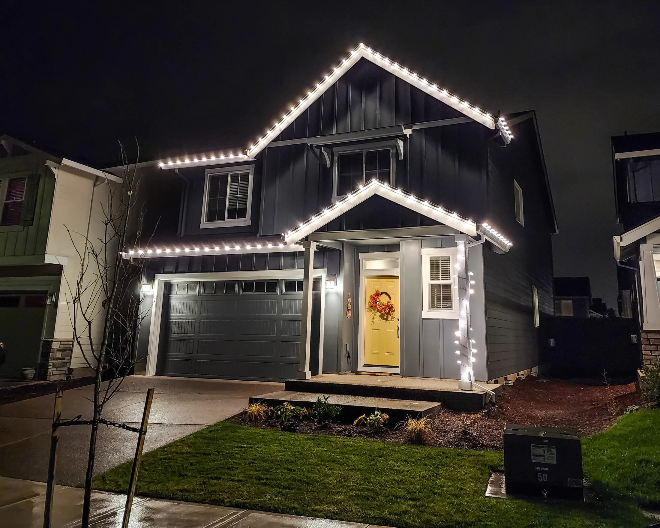Residential Christmas light installation 17 by Premium Holiday Lights in Salem, OR, warm commercial-grade C9 LED roofline lighting at night