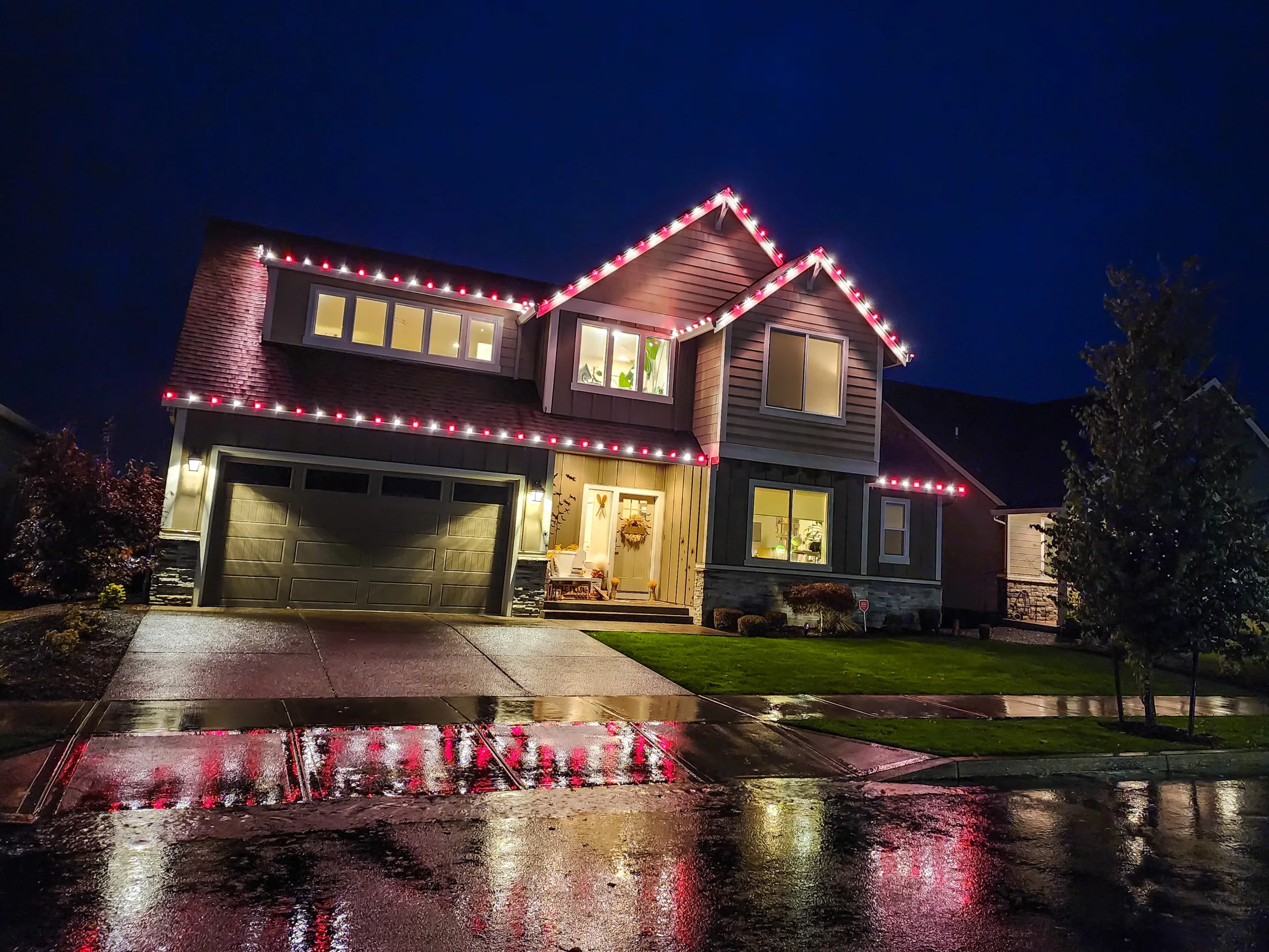 Residential Christmas light installation 24 by Premium Holiday Lights in Salem, OR, warm commercial-grade C9 LED roofline lighting at night