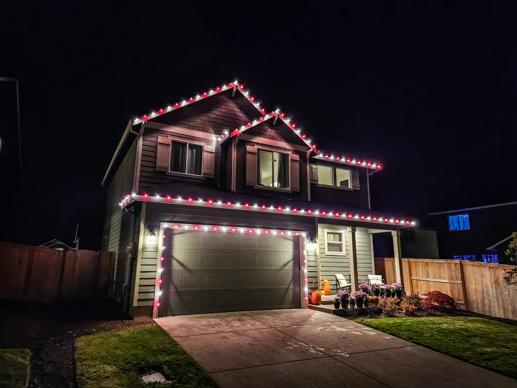 Residential Christmas light installation 23 by Premium Holiday Lights in Salem, OR, warm commercial-grade C9 LED roofline lighting at night