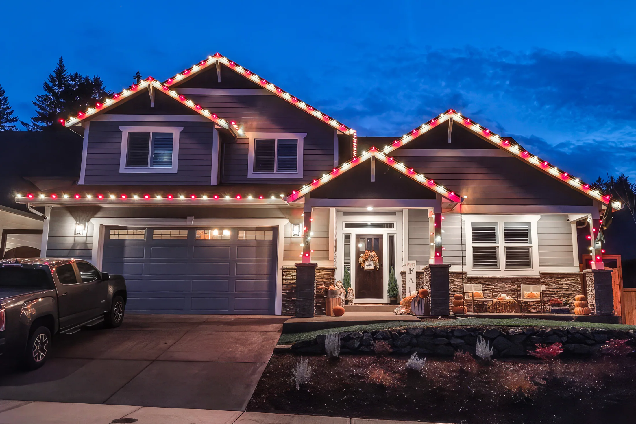 Residential Christmas light installation 28 by Premium Holiday Lights in Salem, OR, warm commercial-grade C9 LED roofline lighting at night