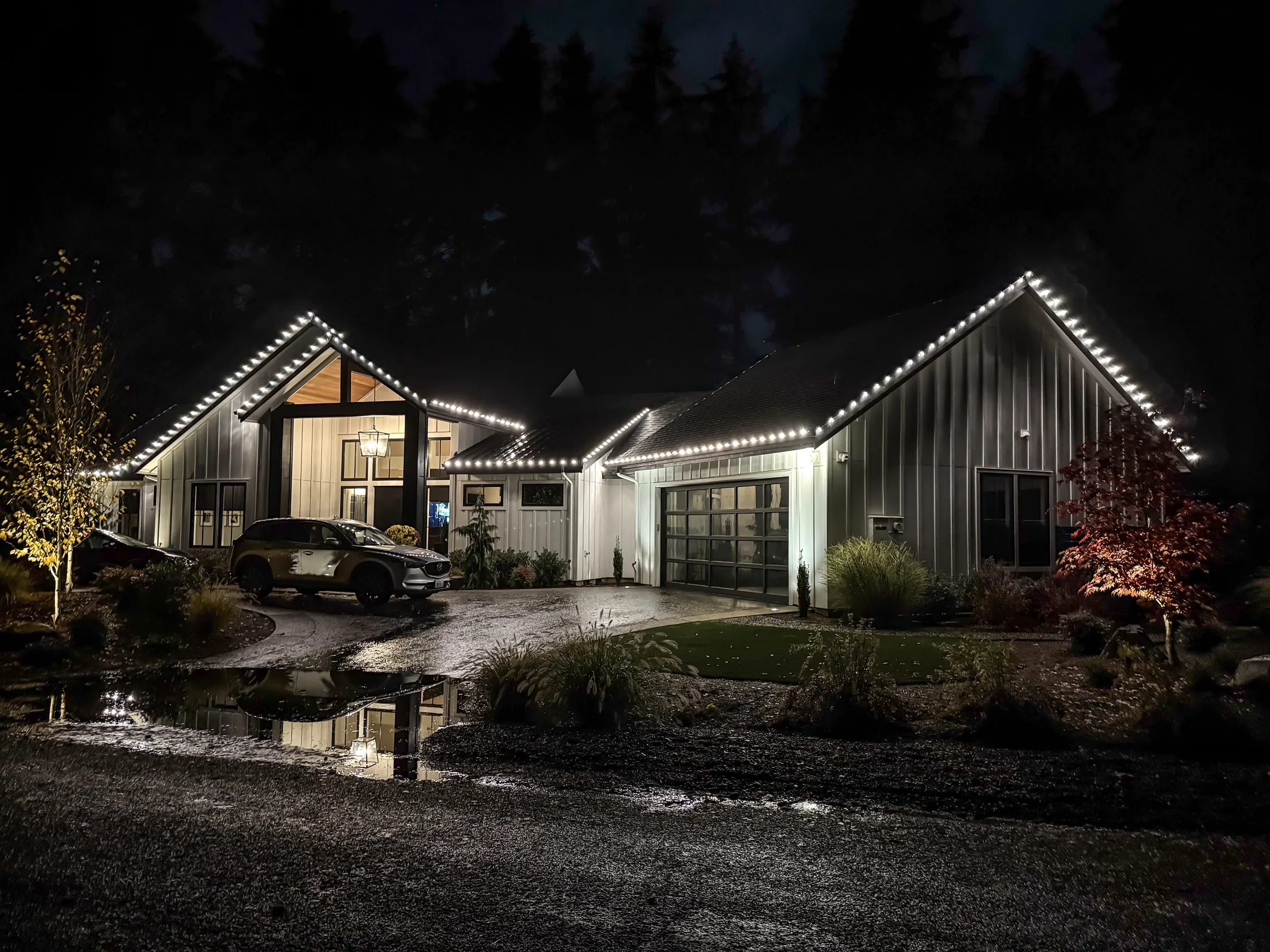 Residential Christmas light installation 31 by Premium Holiday Lights in Salem, OR, warm commercial-grade C9 LED roofline lighting at night