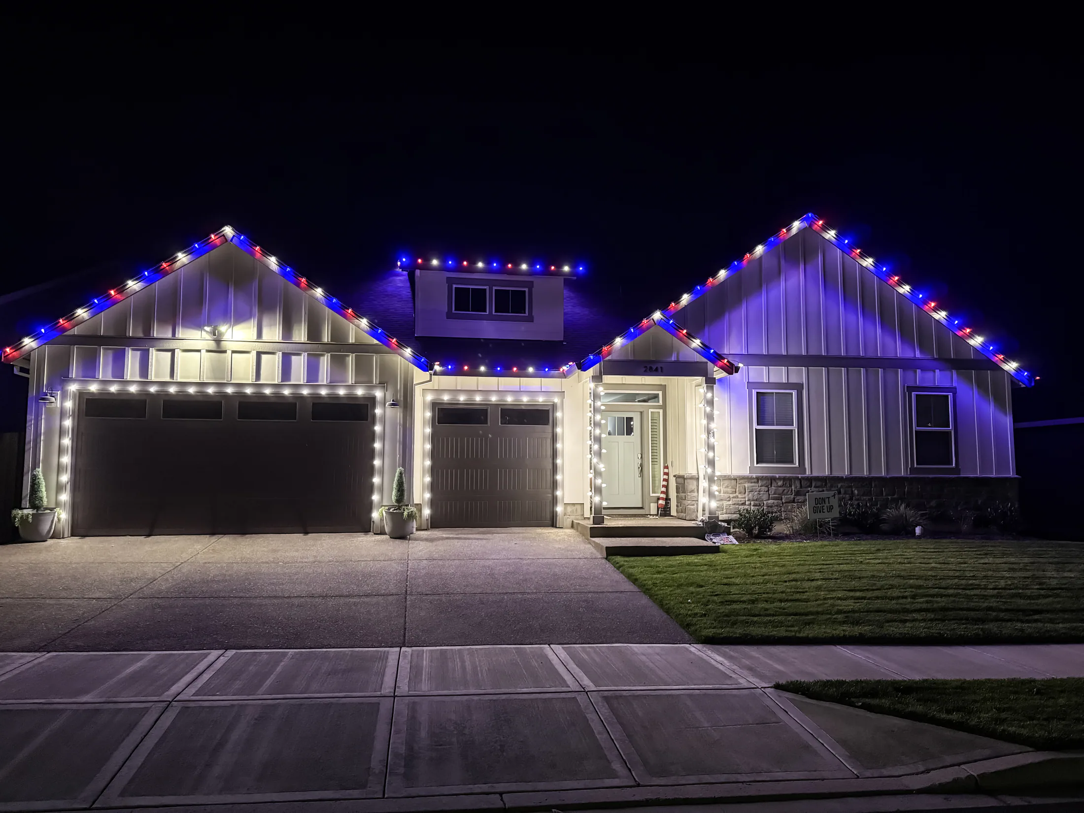 Residential Christmas light installation 29 by Premium Holiday Lights in Salem, OR, warm commercial-grade C9 LED roofline lighting at night