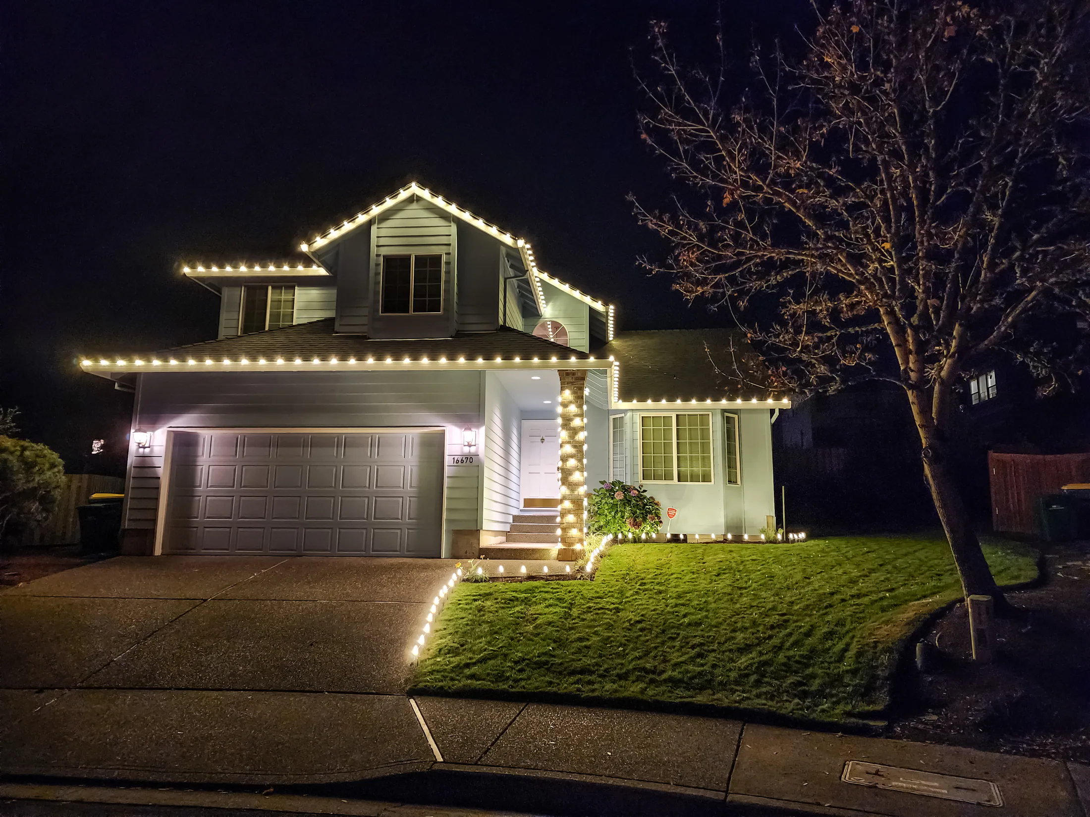 Residential Christmas light installation 34 by Premium Holiday Lights in Salem, OR, warm commercial-grade C9 LED roofline lighting at night