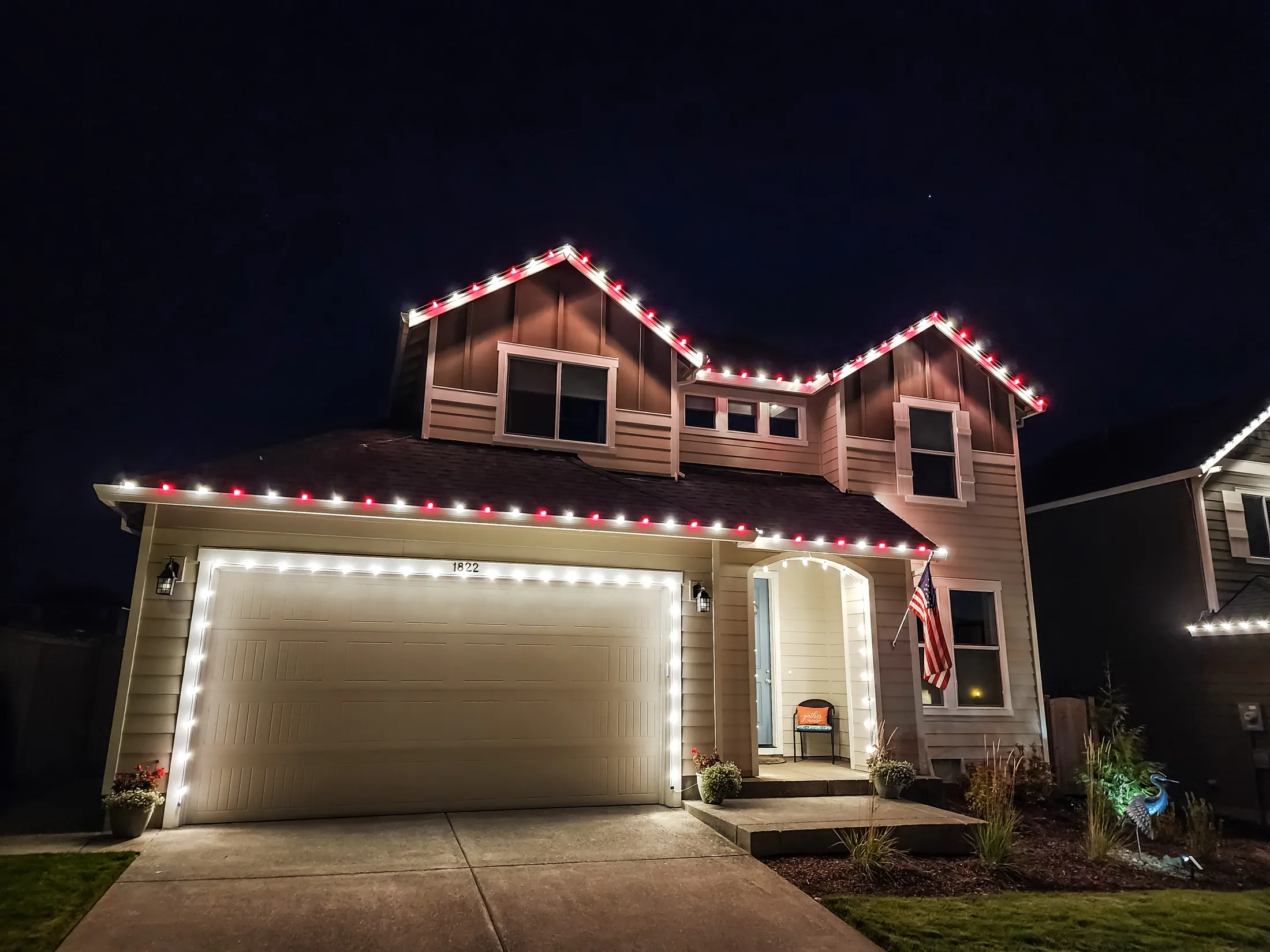 Residential Christmas light installation 35 by Premium Holiday Lights in Salem, OR, warm commercial-grade C9 LED roofline lighting at night