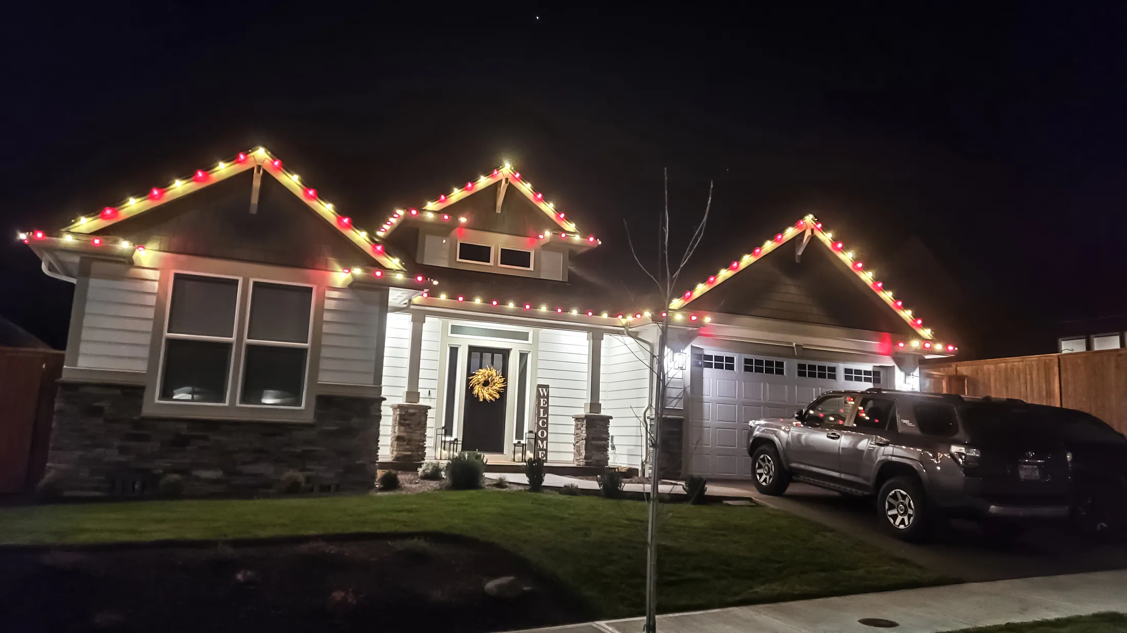 Residential Christmas light installation 36 by Premium Holiday Lights in Salem, OR, warm commercial-grade C9 LED roofline lighting at night