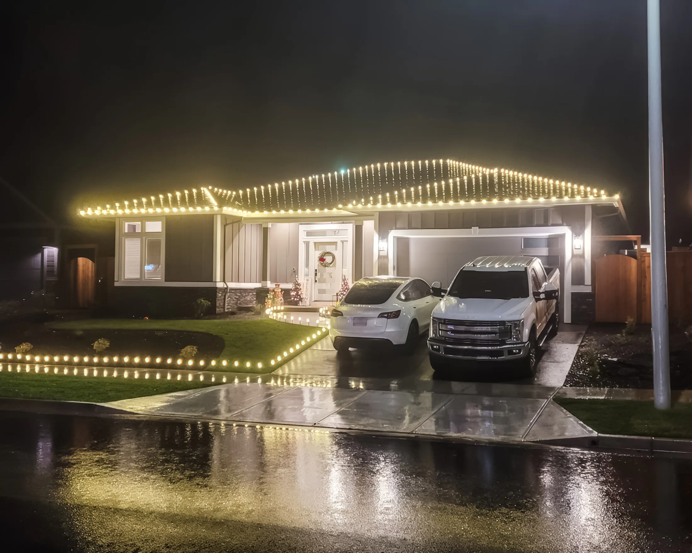 Residential Christmas light installation 37 by Premium Holiday Lights in Salem, OR, warm commercial-grade C9 LED roofline lighting at night
