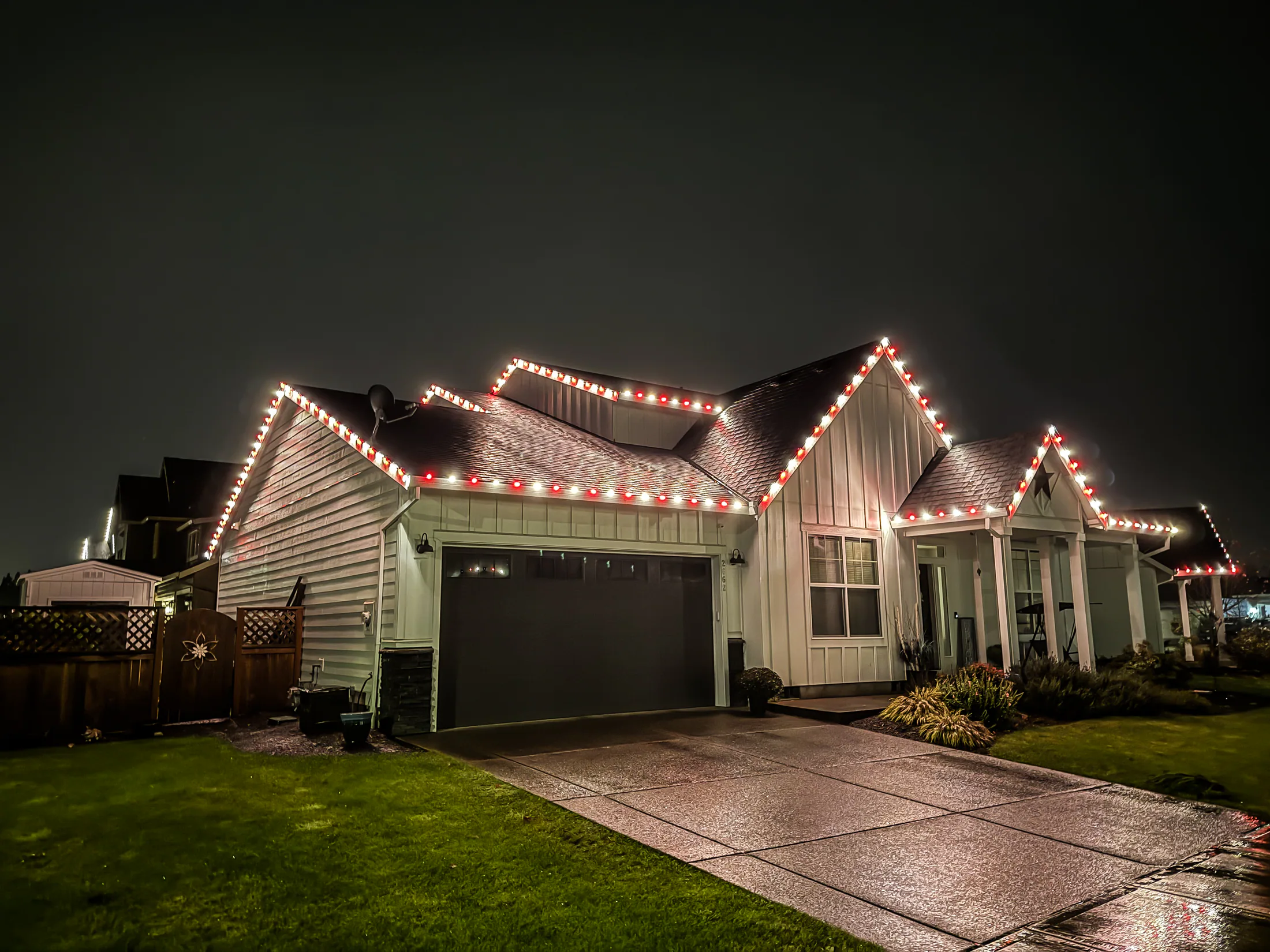 Residential Christmas light installation 41 by Premium Holiday Lights in Salem, OR, warm commercial-grade C9 LED roofline lighting at night