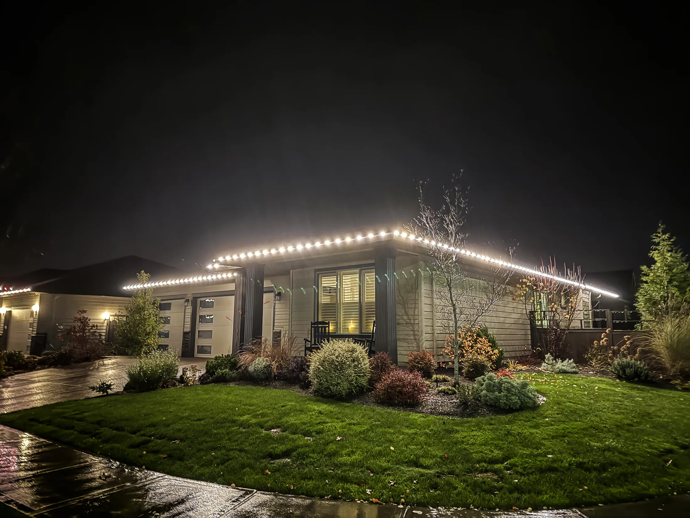 Residential Christmas light installation 40 by Premium Holiday Lights in Salem, OR, warm commercial-grade C9 LED roofline lighting at night