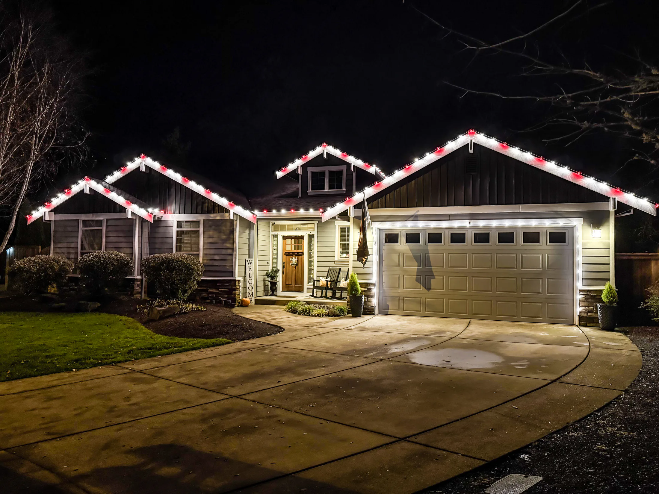 Residential Christmas light installation 43 by Premium Holiday Lights in Salem, OR, warm commercial-grade C9 LED roofline lighting at night