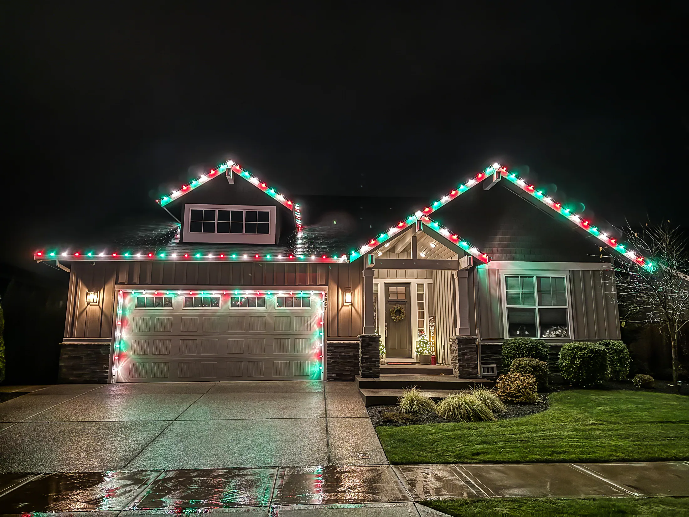 Residential Christmas light installation 42 by Premium Holiday Lights in Salem, OR, warm commercial-grade C9 LED roofline lighting at night