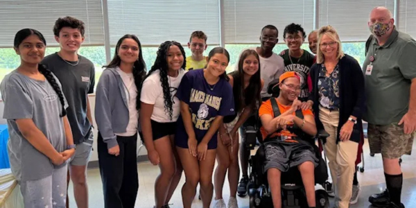 Group of students and staff posing for a picture