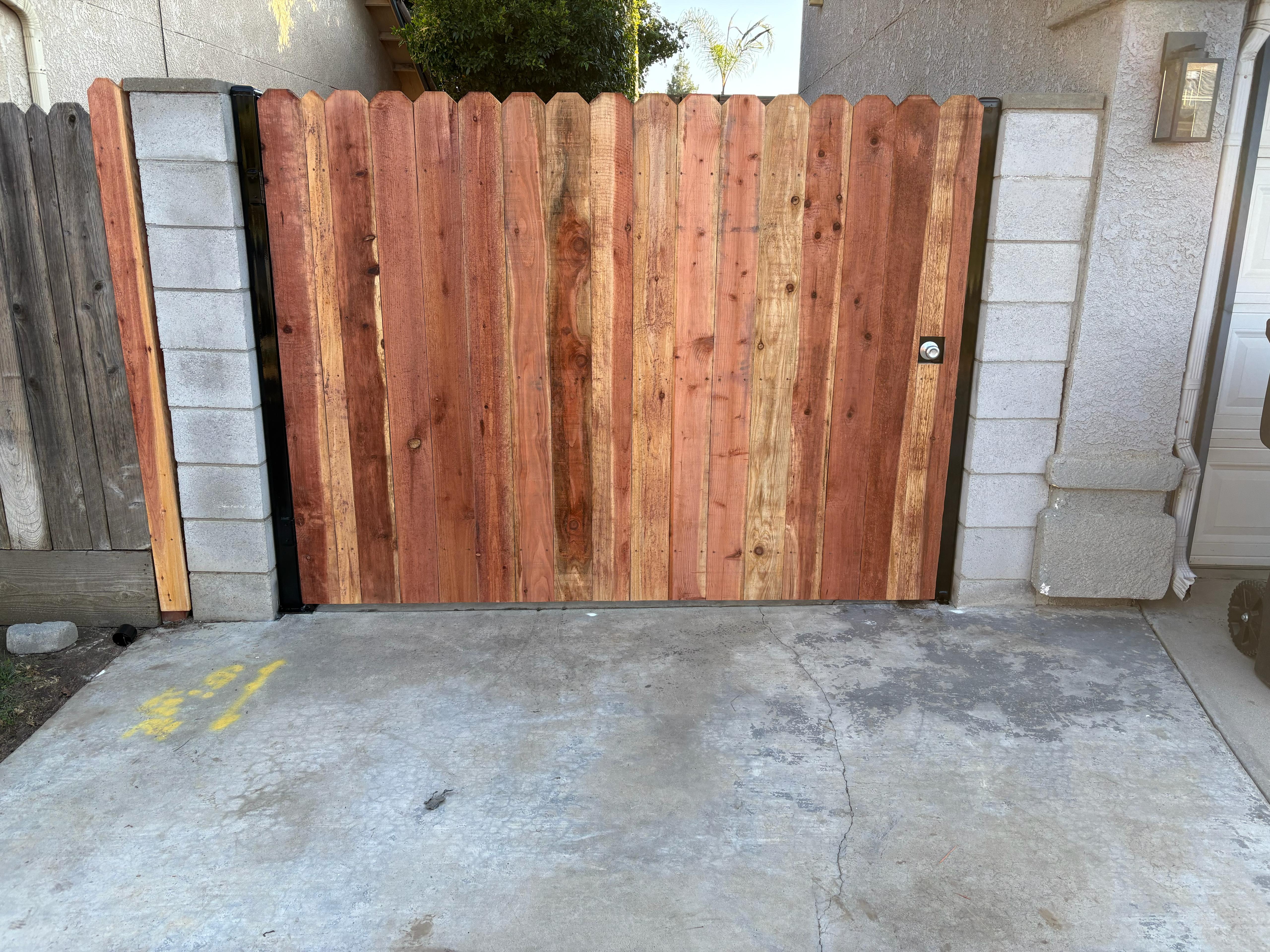 Redwood dog-ear privacy fence