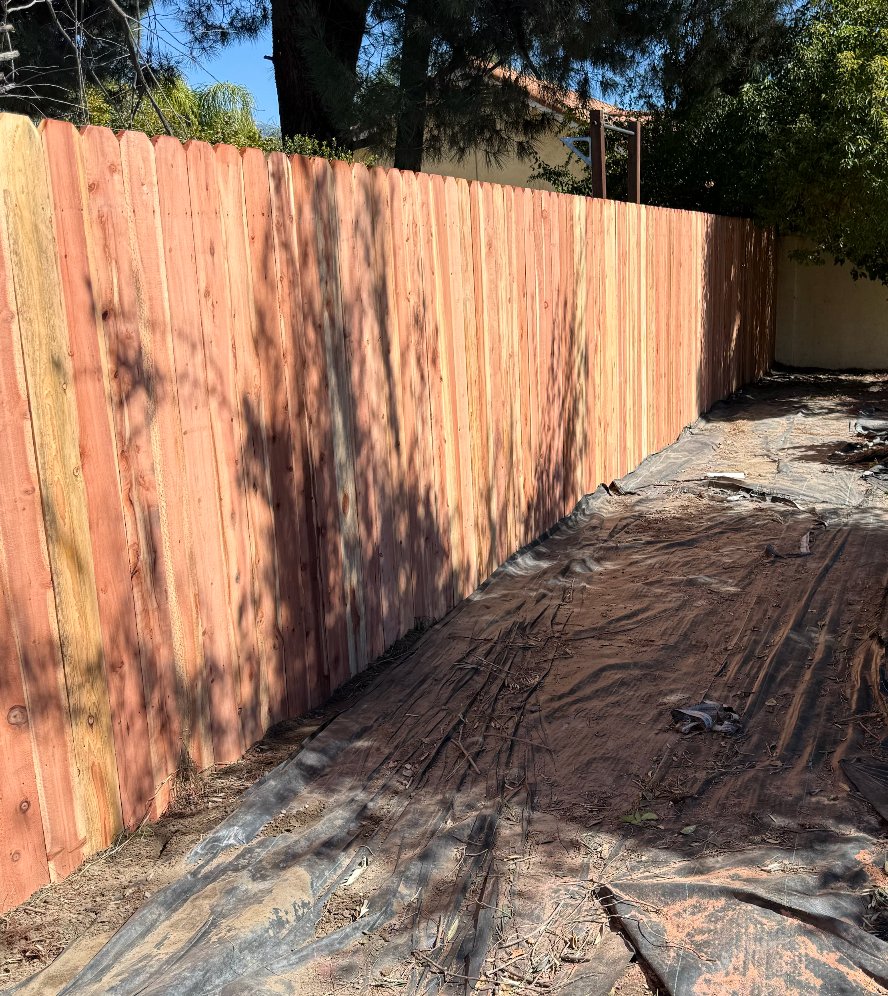Dog-ear redwood wood fence at corner lot in Moreno Valley, California