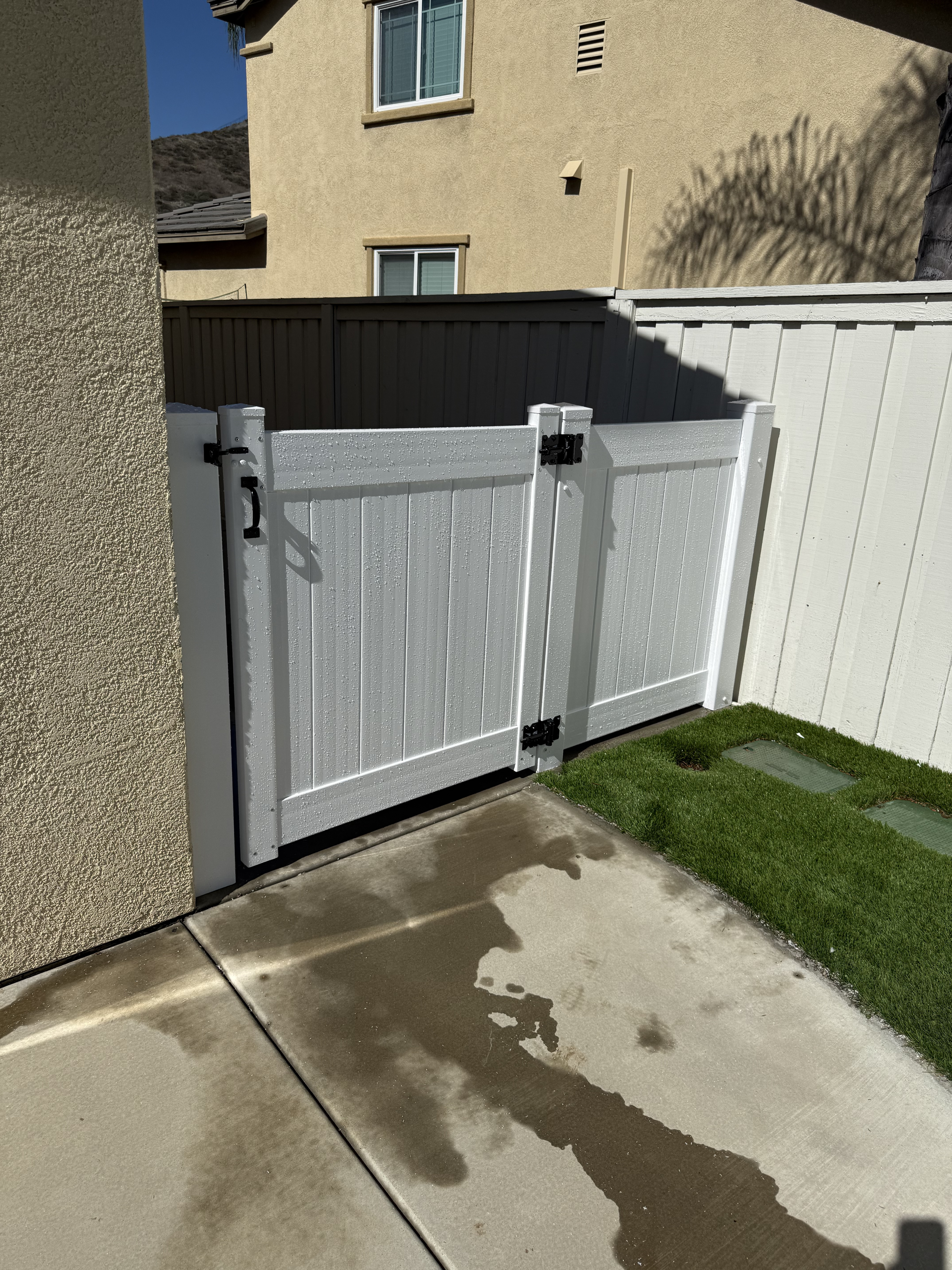 White privacy vinyl gate and fence installation in Menifee, California