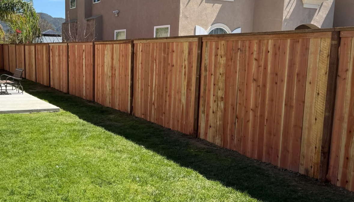 Redwood wood privacy fence installation in Lake Elsinore, California