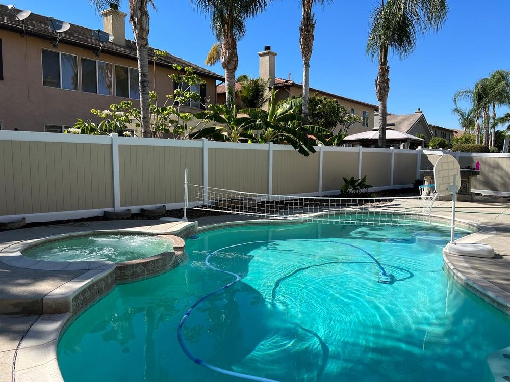 Tan and white vinyl privacy fence installation in Murrieta, California