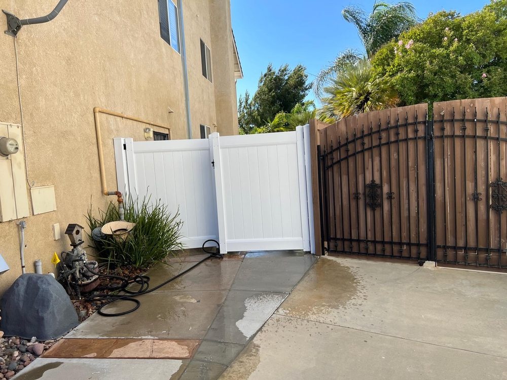 Metal-frame vinyl gate installation in Riverside County, California by ML Fencing