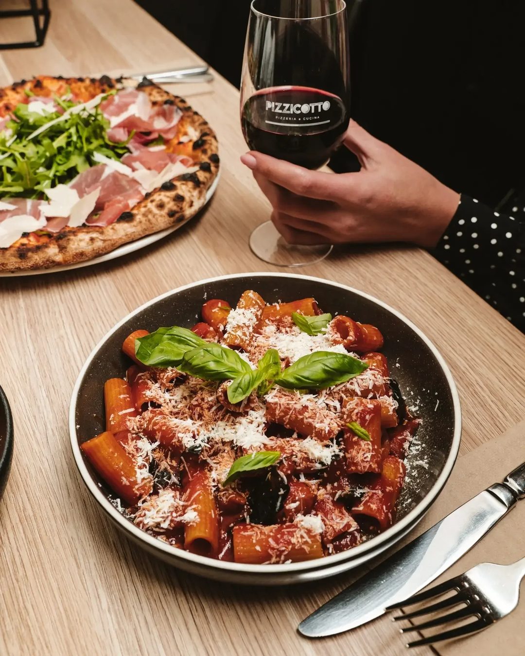 Pizza, handmade pasta and a glass of wine shared at Pizzicotto