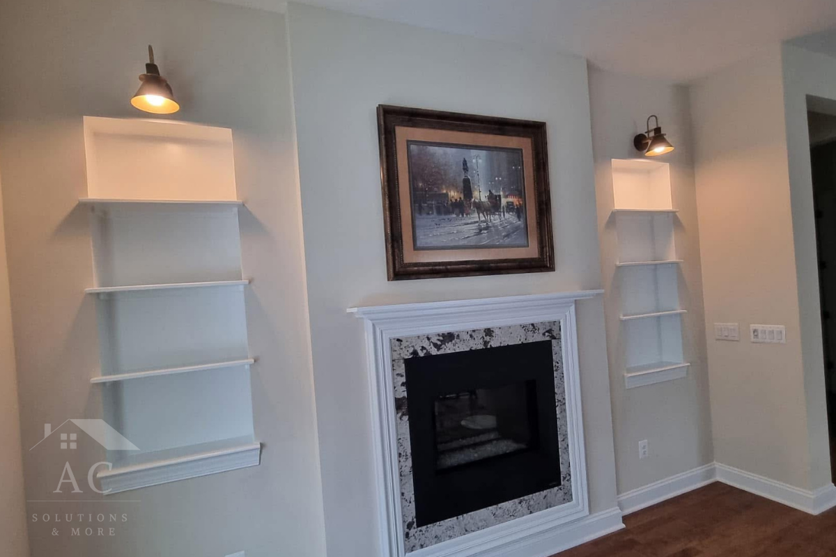 Custom wood mantel and built-in lighted bookshelves in Lake Frederick, VA