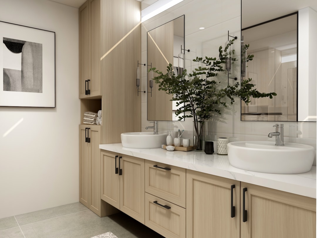 Custom double vanity with vessel sinks and full-height cabinetry in luxury bathroom remodel