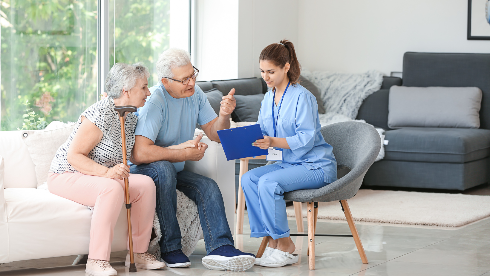 Caregiver consulting with elderly couple