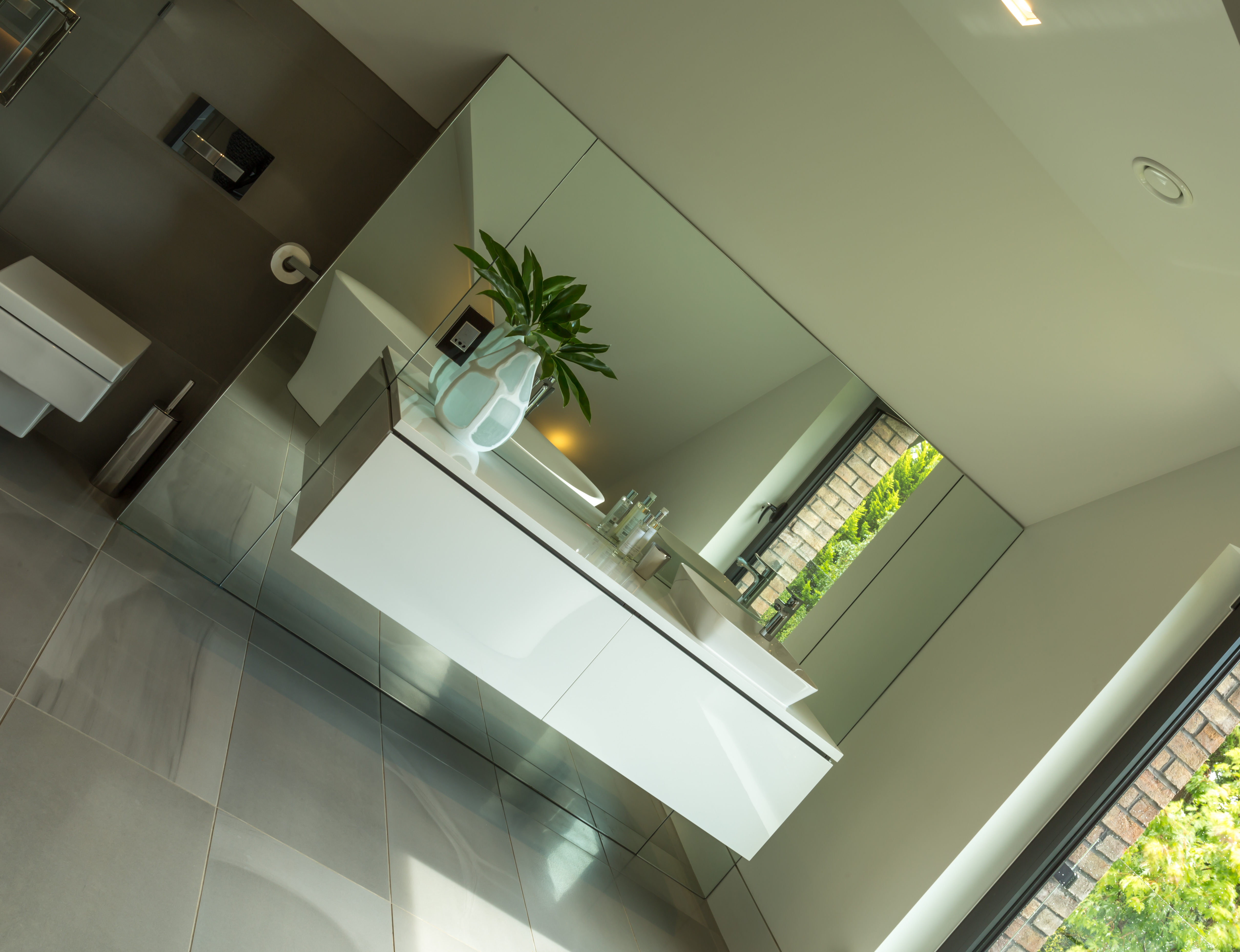 Floor-standing statement mirrors in dining room
