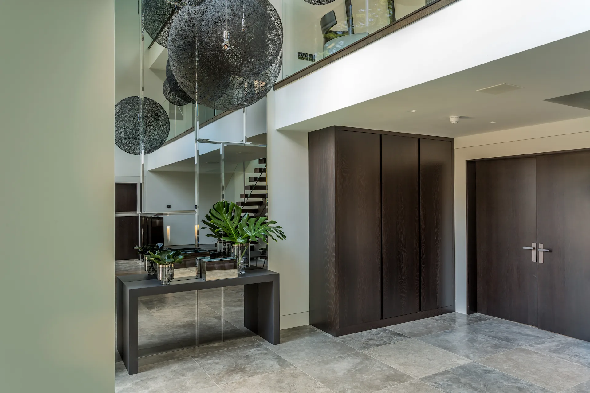 Bespoke antique mirrored hallway wall installation