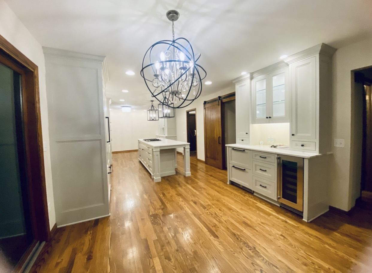 Kitchen and dining area after a detailed clean, floors and fixtures finished