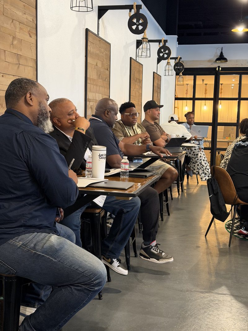 Pastors seated in a row at City First LA, listening and taking notes