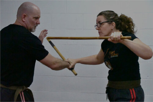 2 6tigers instructors sparring with kali sticks demonstrating modern arnis
