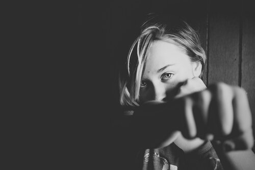 a woman directing a punch 
