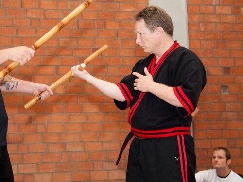 Modern arnis master brian sparring with kali sticks in the manotick dojo