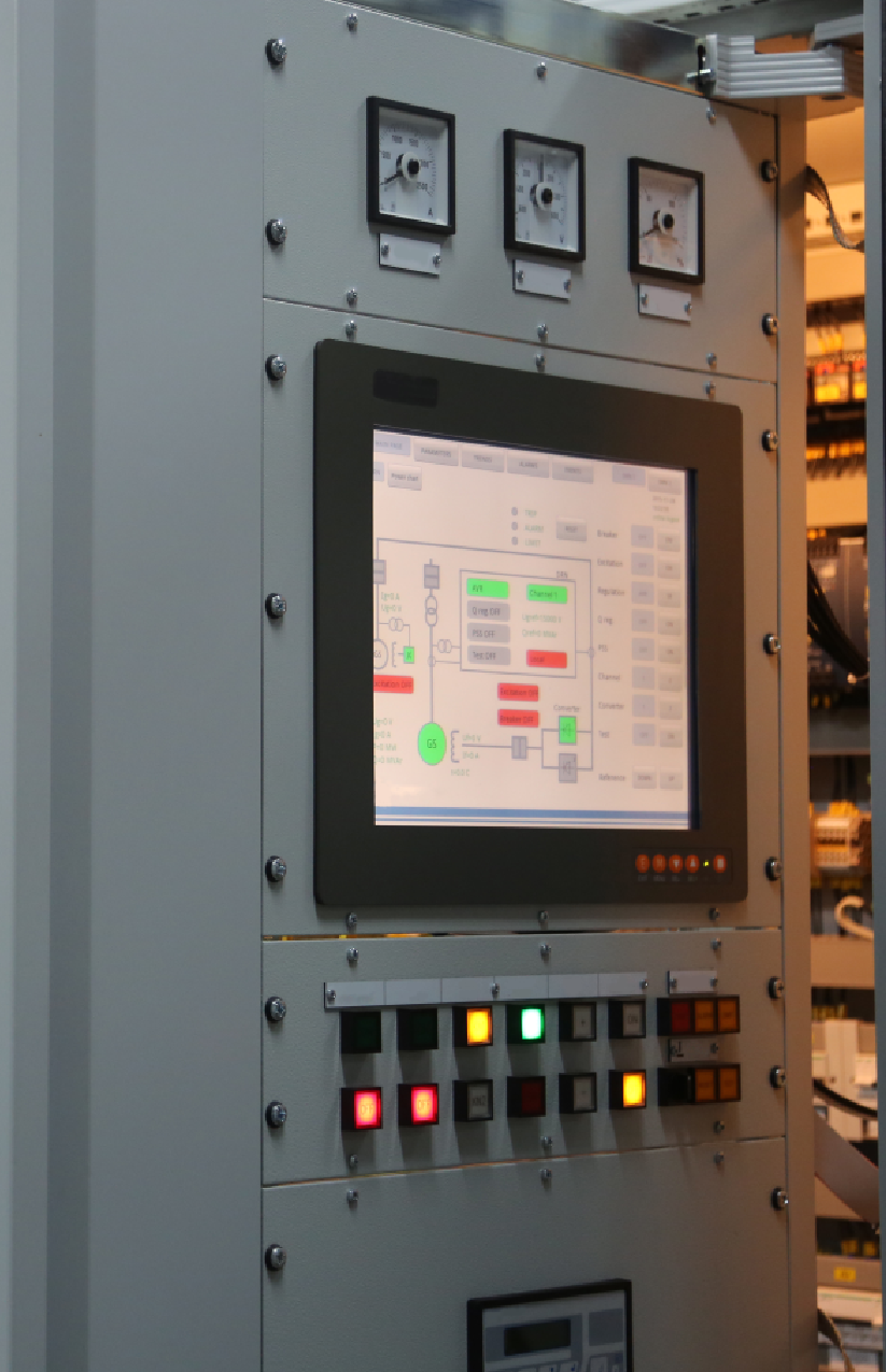 Close-up of a hydroelectric power control panel with digital interface – part of ETS's advanced control system services