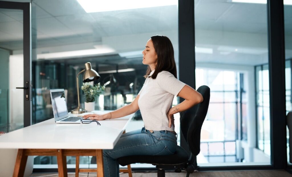 Sitting at a desk with back pain