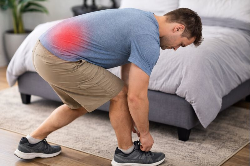 Bending to put on shoes with back pain