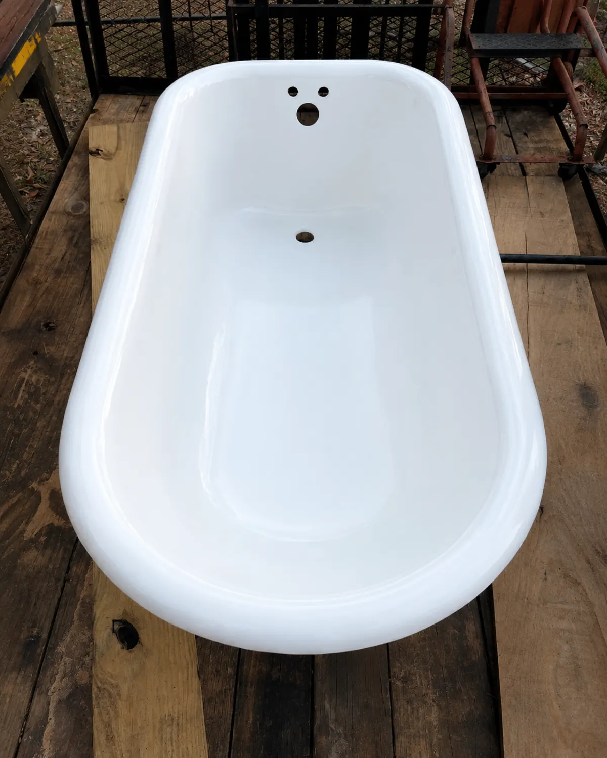 Same bathtub after BathMasters refinishing on the Gulf Coast, glossy white finish