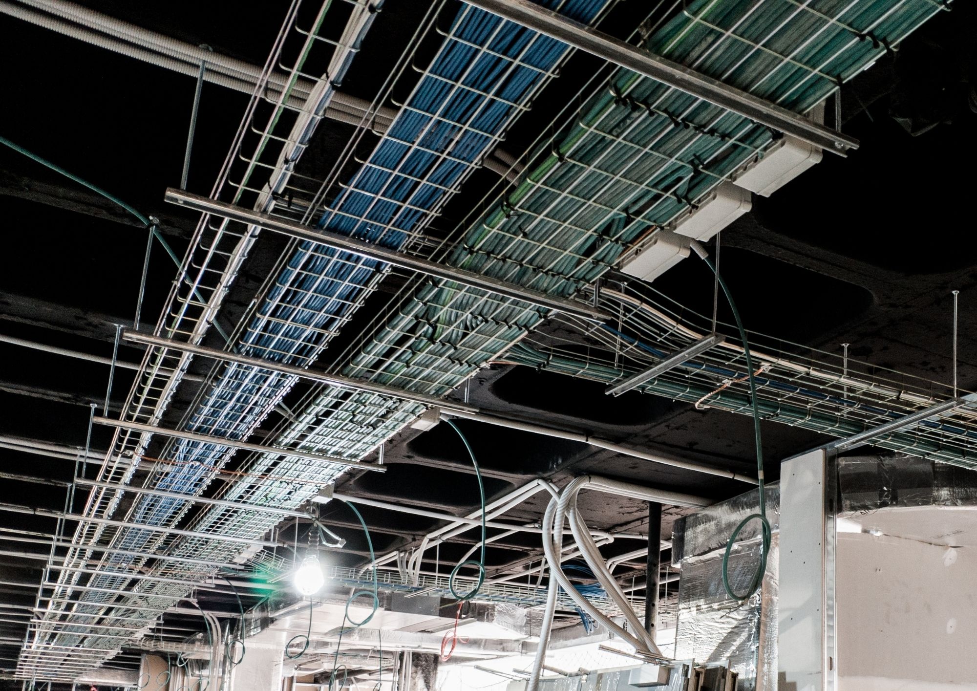 Cable tray and low voltage pathways above an open ceiling in a commercial New York building