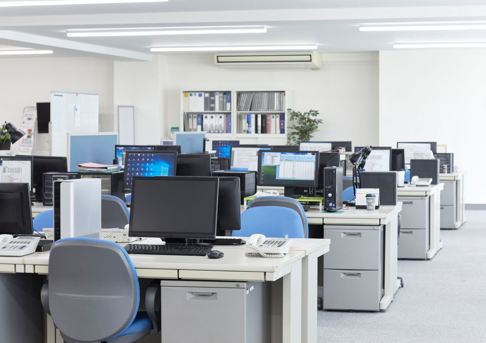 Open plan commercial office with cabled workstations in New York City