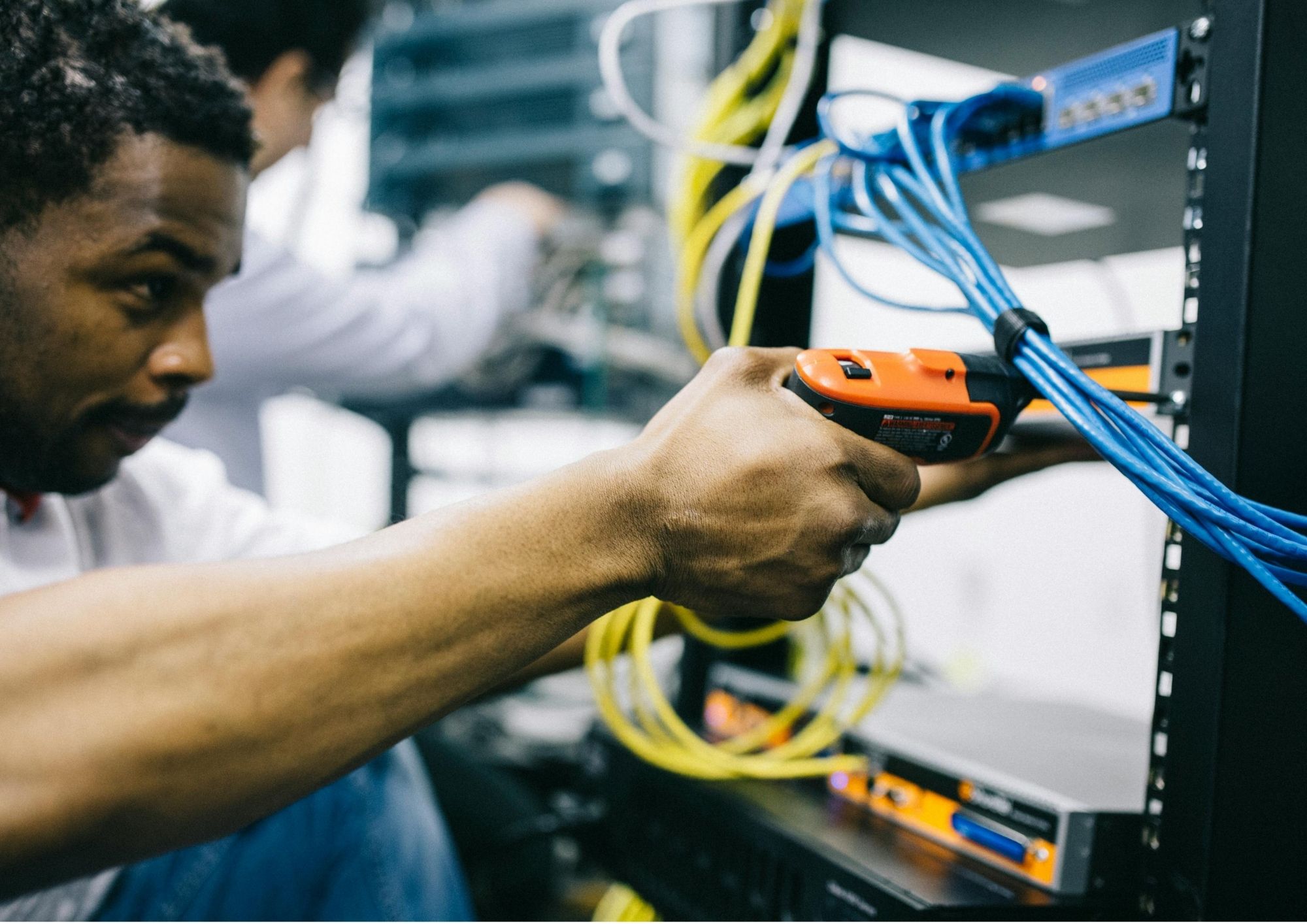 Technician certifying an installed cable run with a Fluke cable analyser