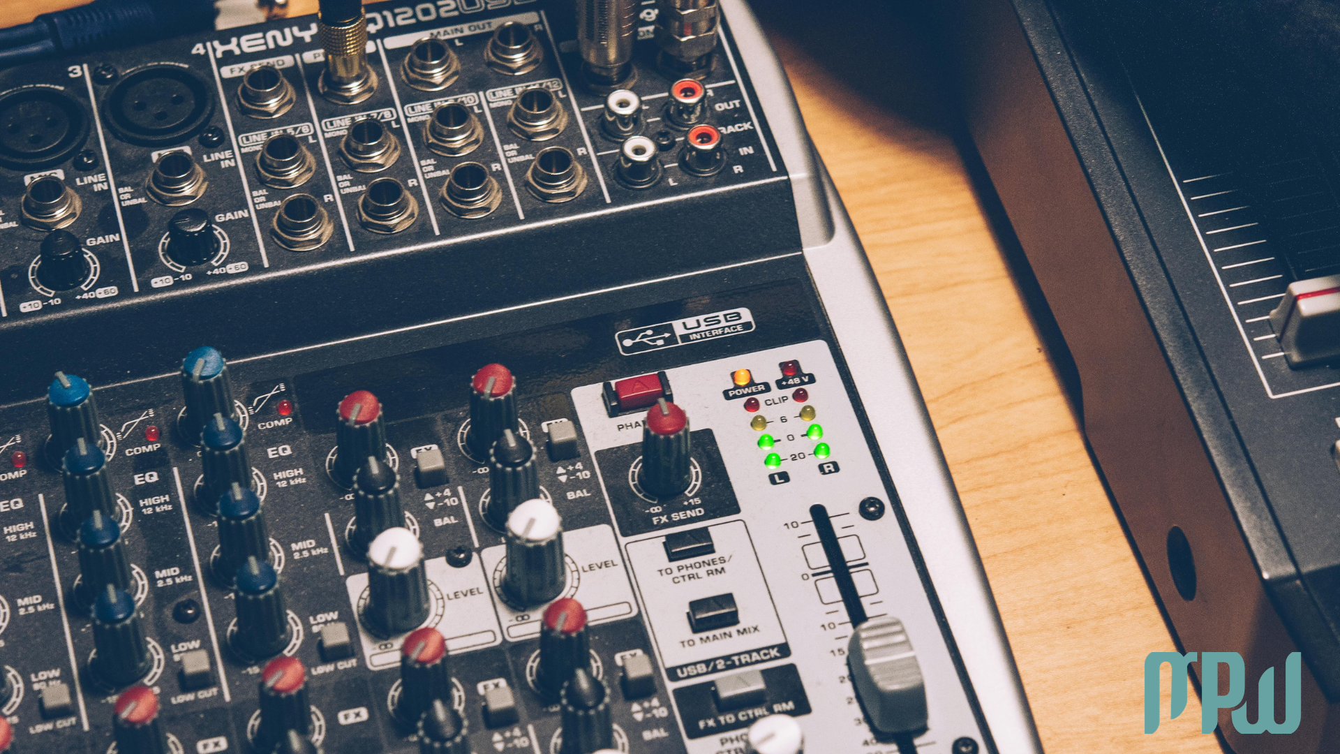Close-up of an audio interface with an XLR microphone connected for home recording