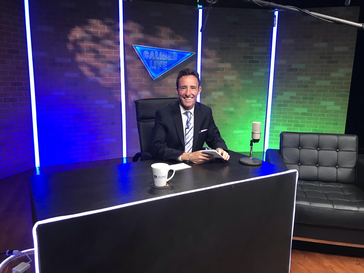 David Ahearn hosting a talk-show panel