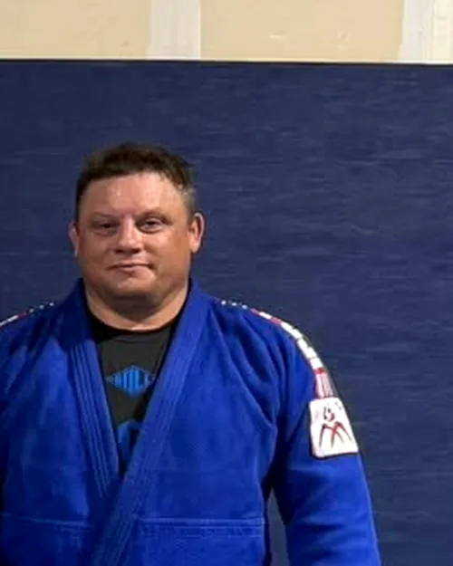 Kyle Bowker, founder of Dominion Academy, in a blue judo gi