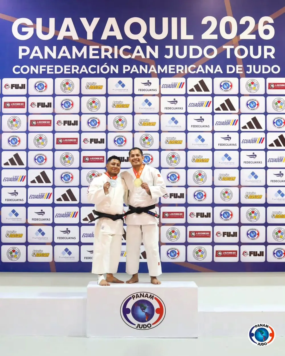 Coach Jhonatan Gutierrez on the podium after winning the -73 kg division at the 2026 Panamerican Judo Tour