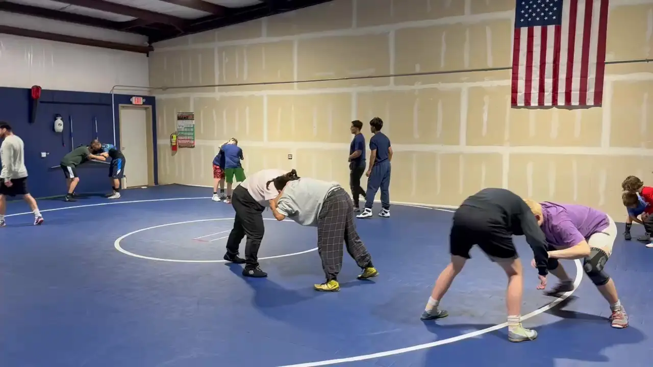 Wrestlers drilling on the mats at Dominion Academy in Mustang